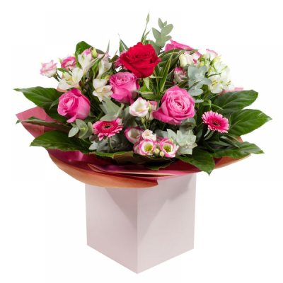 The Secret Admirer - A hand-tied in water to be wrapped and presented using mainly pink flowers to predominate, but florist must include a single high grade rose.